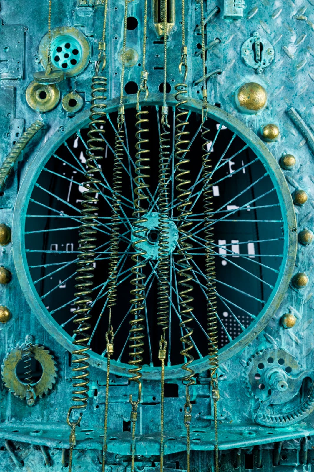 ASMASINA — macro of spoked wheel and springs