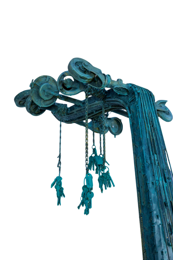 Macro of a sculpture — chains, patinated metal and brass